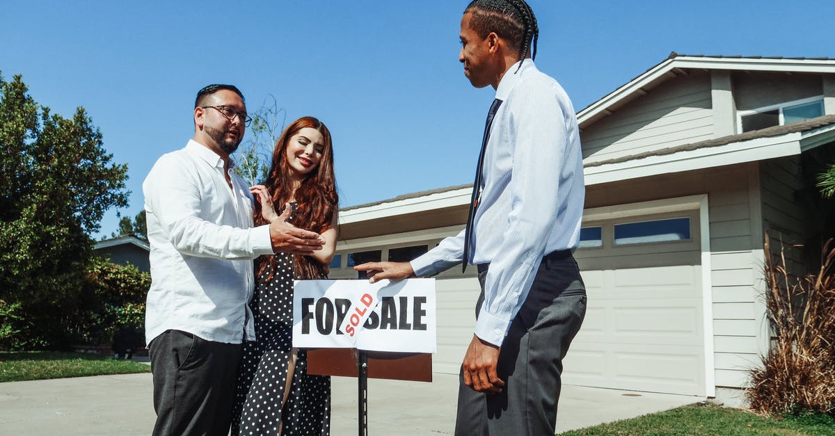 Why does my house get sold when I buy a garage in GTA Online? [closed] - Man and Woman Standing Beside an Agent