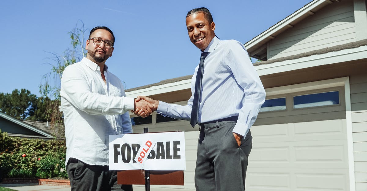 Why does my house get sold when I buy a garage in GTA Online? [closed] - Men Shaking Hands