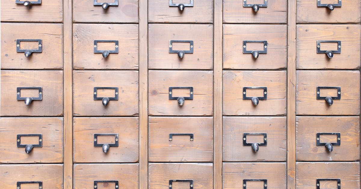 Why does my Minecraft keep crashing? - Background of wall full of many similar aged shabby vintage wooden drawers with metal round handles