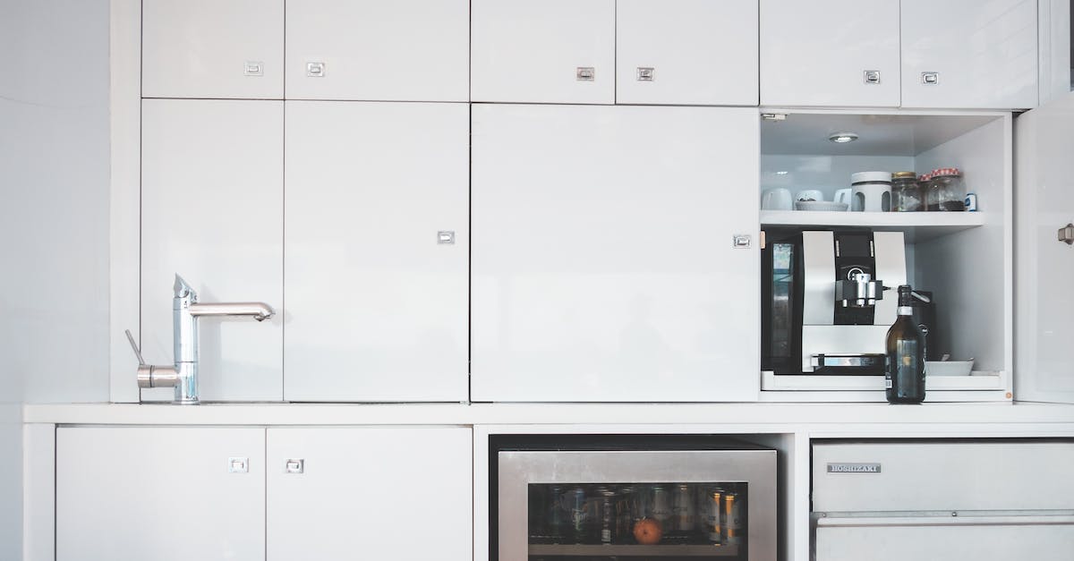 Why does my obsidian boat sink? - Interior of minimalist style kitchen with white furniture and steel appliances in modern boat Why does my obsidian boat sink? - Interior of minimalist style kitchen with white furniture and steel appliances in modern boat