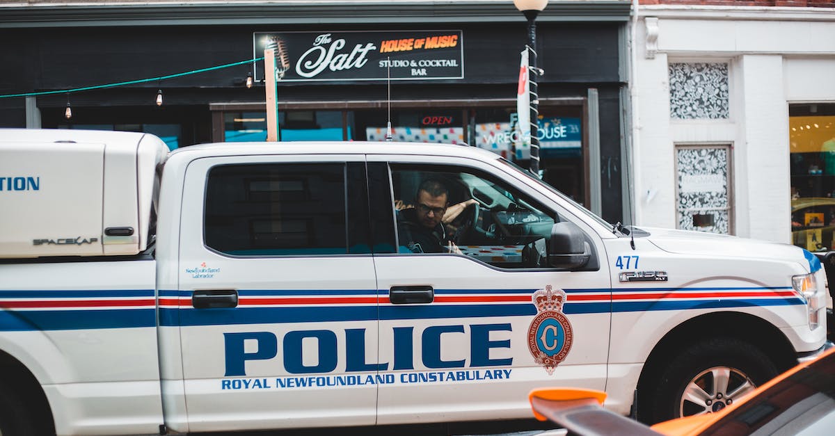 Why does my opponent keep driving into a wall? - Policeman sitting in police car driving on street
