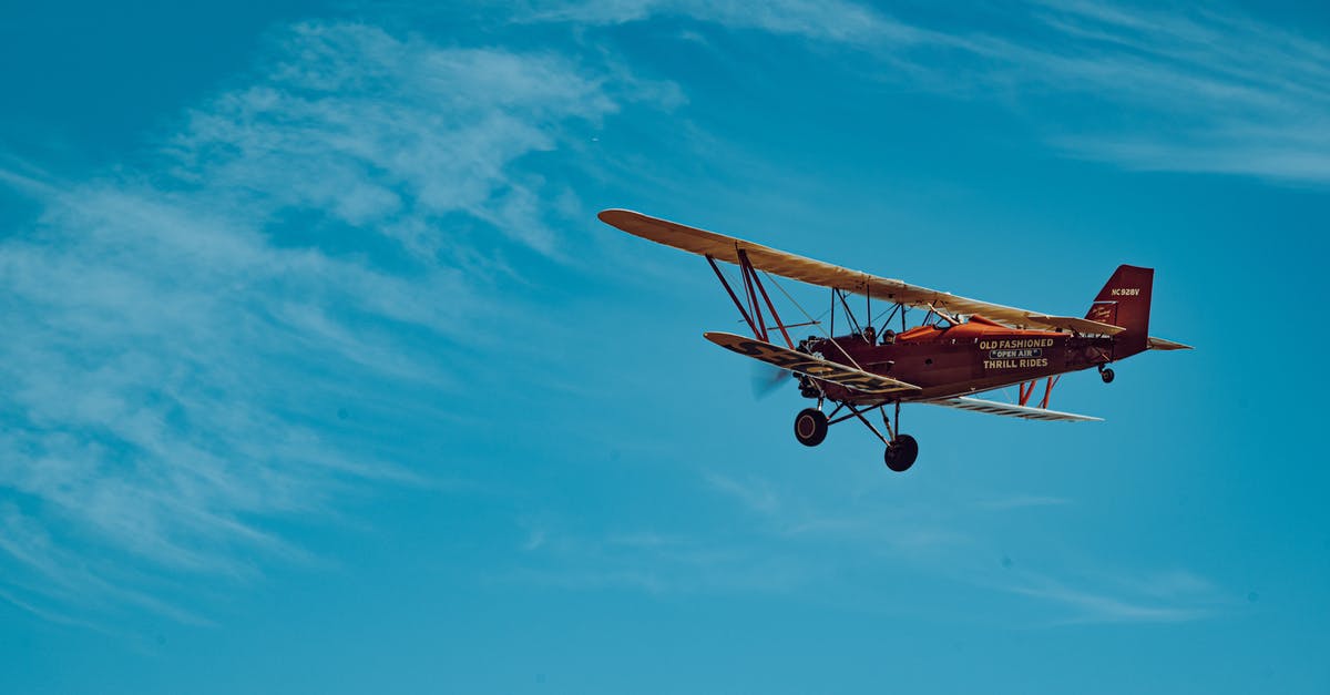 Why does my plane roll so hard? - Orange and White Airplane in Mid Air