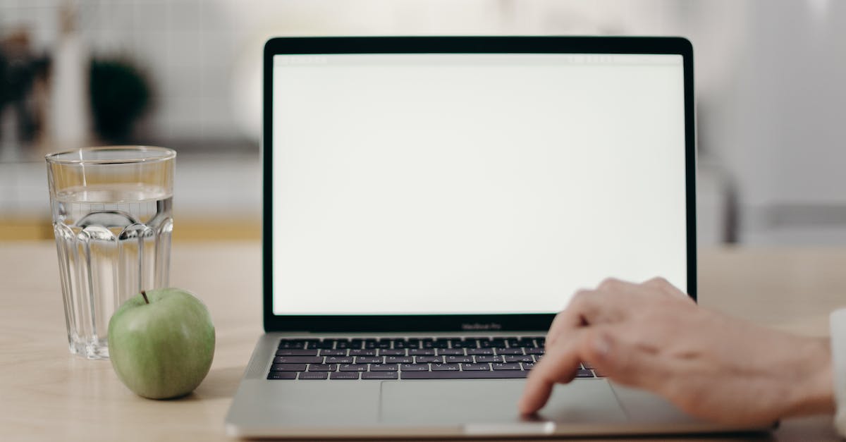 Why does my screen go completely blank when I try to use my AV cords? - Photo Of Person Using Laptop