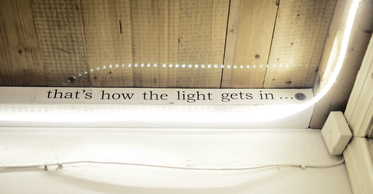 Why does shift-queuing blink have unpredictable results? - High angle of text written on window decorated with shiny lights reflecting in glass