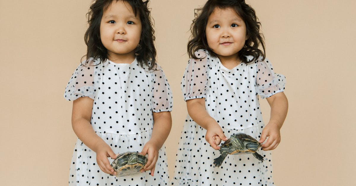 Why does the Ash Twin Project require rotation for artificial gravity? - Small Twin Girls Holding Turtles