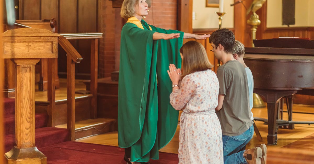 Why does the Blessing of talos have this effect? - Woman Gives Blessing To People Kneeling Down