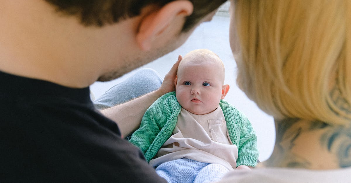 Why does the ship in Dead Space carry babies? - Crop parents communicating with newborn baby in arms