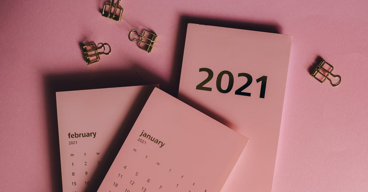 Why does the year only go from March to October? - Top view of modern paper calendars with numbers and words near metal clips on pink background Why does the year only go from March to October? - Top view of modern paper calendars with numbers and words near metal clips on pink background
