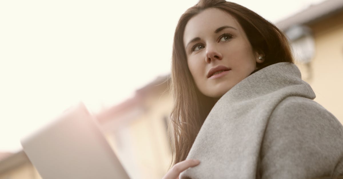 Why doesn't my character/universe/profile sync between computers? [closed] - Woman in Gray Hoodie Sweater Holding a Silver Tablet