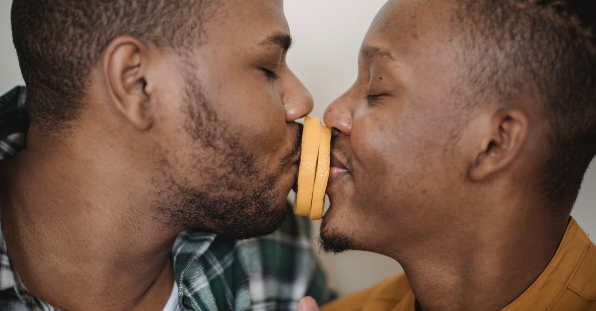 Why doesn't my character/universe/profile sync between computers? [closed] - Two Men Kissing With Orange Slices Between Them