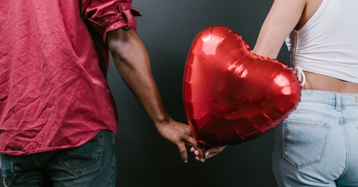 Why doesn't my heir inherit my wife's titles? - Two Persons Holding a Red Heart Shaped Balloons