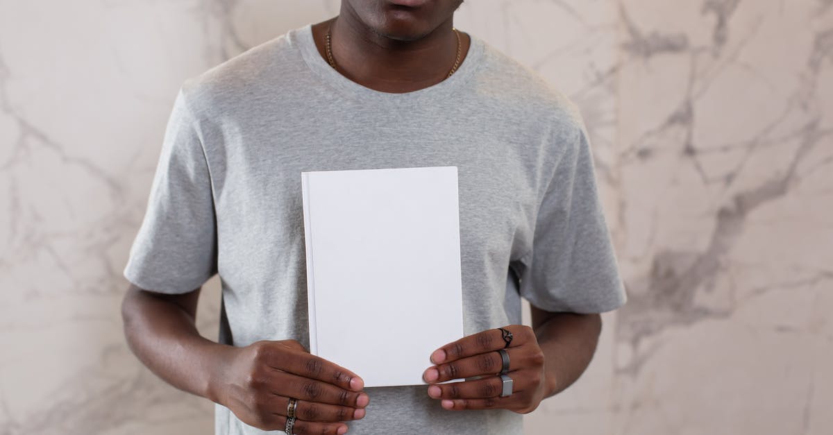 Why doesn't my nearby list show any Pokémons? [duplicate] - Unrecognizable African American male in casual gray t shirt standing with white mock up notepad in hands near wall in light room