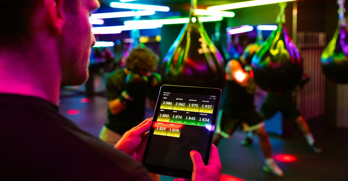 Why doesn't my PS3 screen fit the TV? - Person Holding Black Tablet