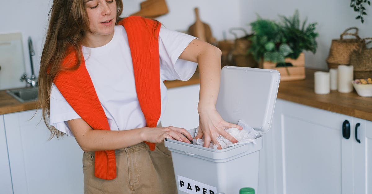 Why don't dwellers collect any items in the waste land? - Happy woman sorting trash in bin Why don't dwellers collect any items in the waste land? - Happy woman sorting trash in bin