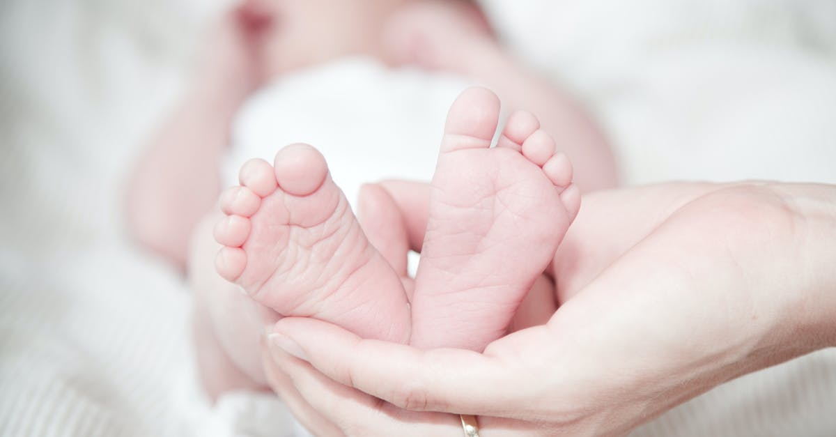 Why don't my female dwellers give birth to children? - Close-up of Hands Holding Baby Feet Why don't my female dwellers give birth to children? - Close-up of Hands Holding Baby Feet