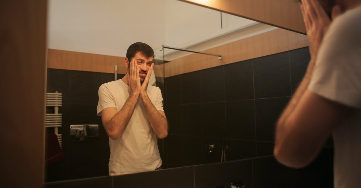 Why don't some demomen suffer from afterburn? - Tired man looking in mirror in bathroom