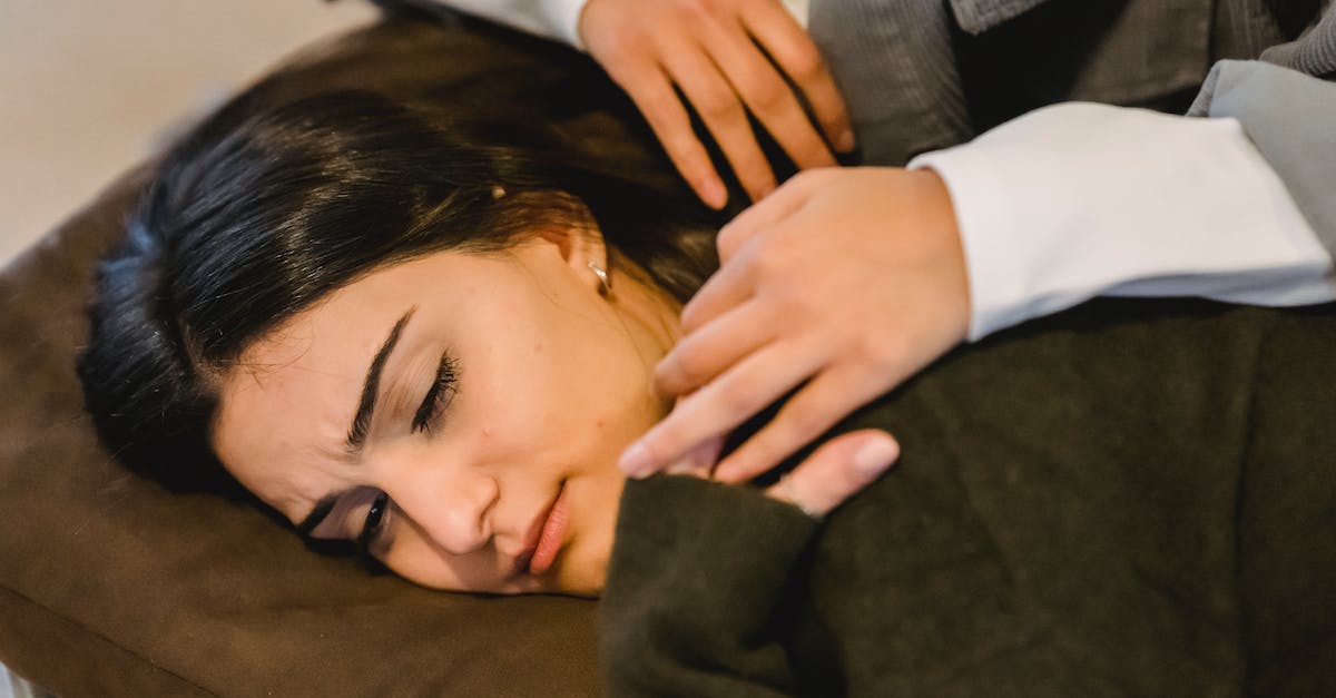 Why don't some demomen suffer from afterburn? - From above of young ethnic sad woman in casual clothes lying on knees of crop anonymous female friend and crying Why don't some demomen suffer from afterburn? - From above of young ethnic sad woman in casual clothes lying on knees of crop anonymous female friend and crying