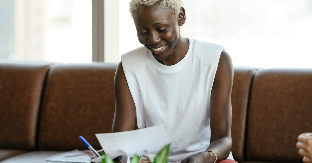 Why don't these /execute parameters check for the entity in the specified position? - Smiling black woman checking contract on leather sofa