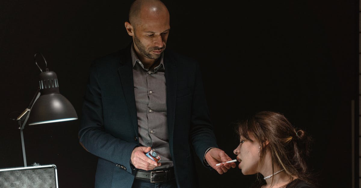 Why is everyone giving me tissues? - A Man in Suit Jacket Giving Cigarette to a Woman 