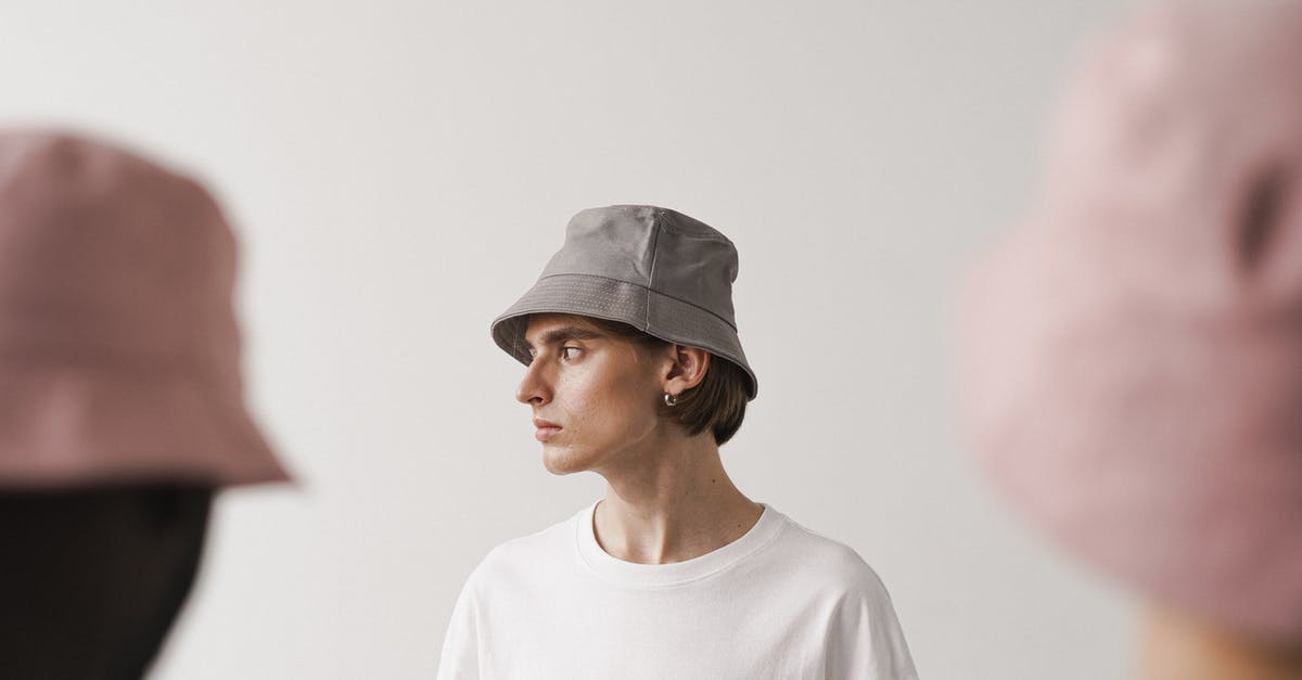 Why is it that only select people DON'T attack a werewolf form? - A Man in a Bucket Hat and White T Shirt