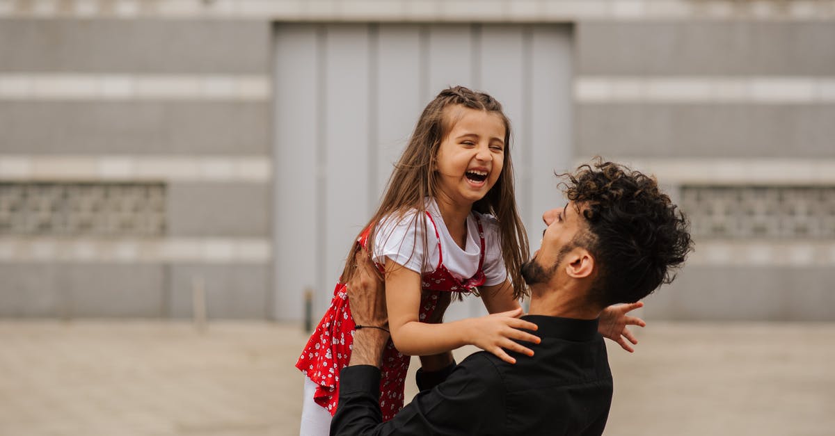 Why is Katarina, a snowball that when played around can carry games considered completely unviable in the LCS? - Man carrying smiling little girl in arms and laughing on city street in summer day