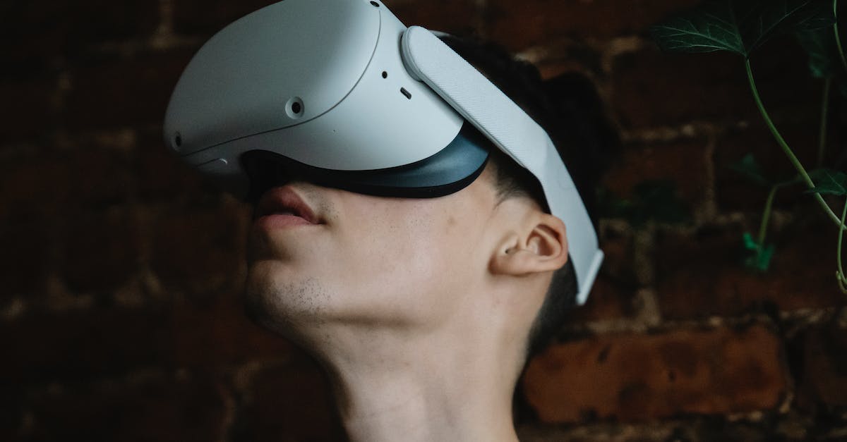 Why is my attempt at night vision goggles not working? - Young male wearing modern goggles of virtual reality and immersing in cyberspace while being in room with brick walls Why is my attempt at night vision goggles not working? - Young male wearing modern goggles of virtual reality and immersing in cyberspace while being in room with brick walls