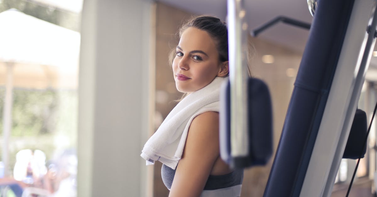 Why is my equipment breaking? - Happy young sportswoman in modern sports club Why is my equipment breaking? - Happy young sportswoman in modern sports club