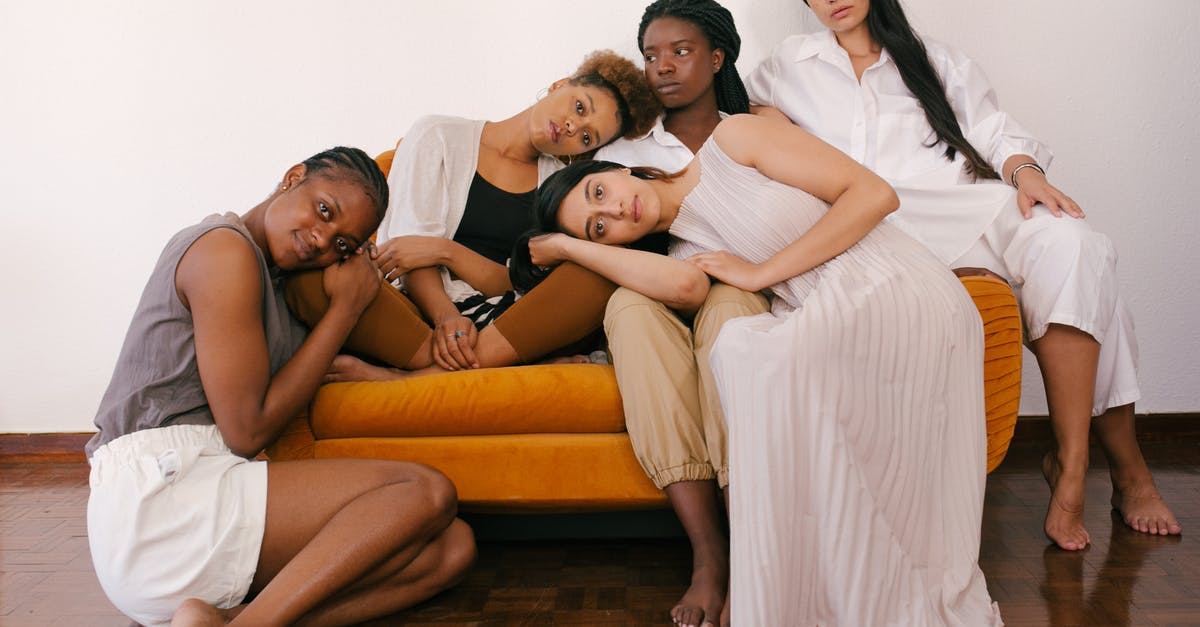 Why is my second playthrough different and harder? - Photo of Women Sitting on Orange Sofa