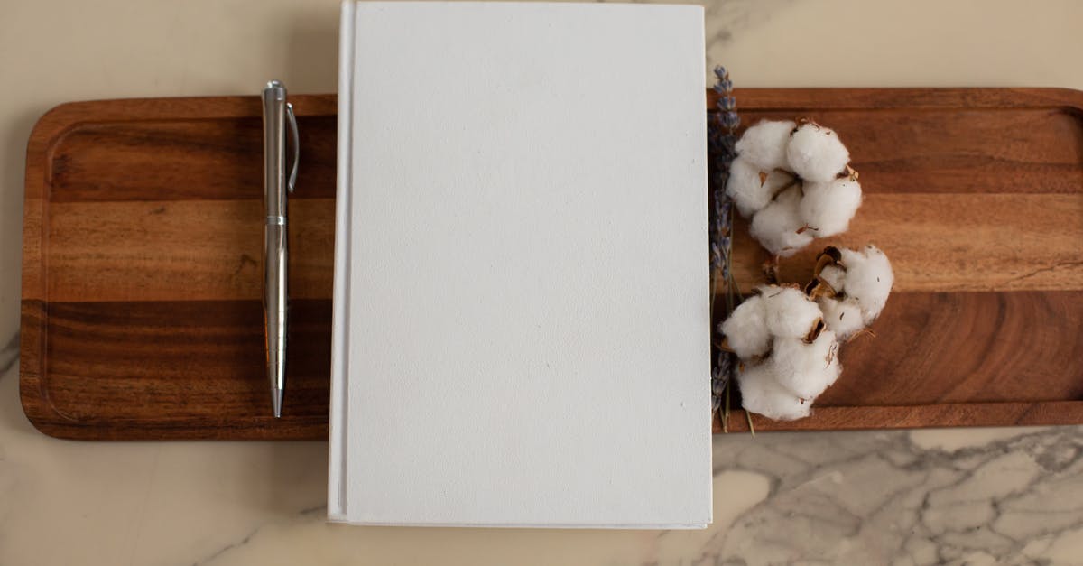 Why is my server list blank/empty? - Overhead view of composition of empty hardcover book lying between metallic pen and soft cotton flowers on wooden tray with recesses