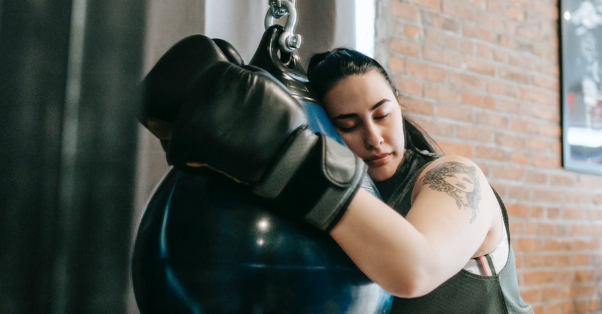 Why is skill-based matchmaking so hard for studios to get right? [closed] - Exhausted female with closed eyes lying on punching ball while having break in boxing workout in gym