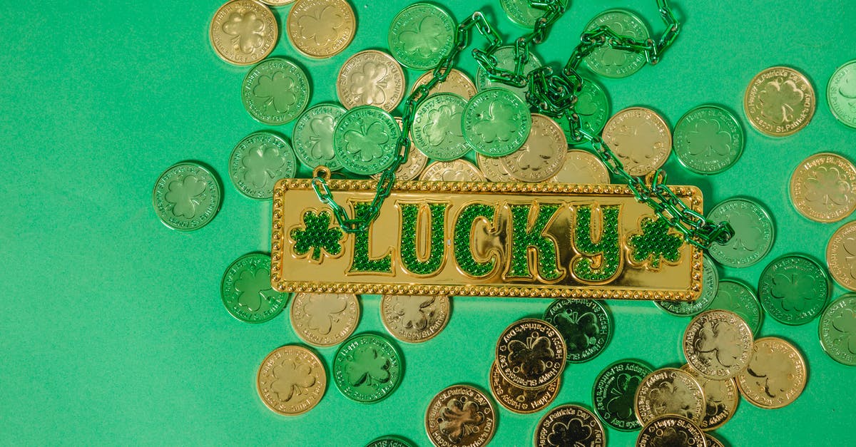 Why is that gold coin glowing green? - Golden lucky charm on coins Why is that gold coin glowing green? - Golden lucky charm on coins