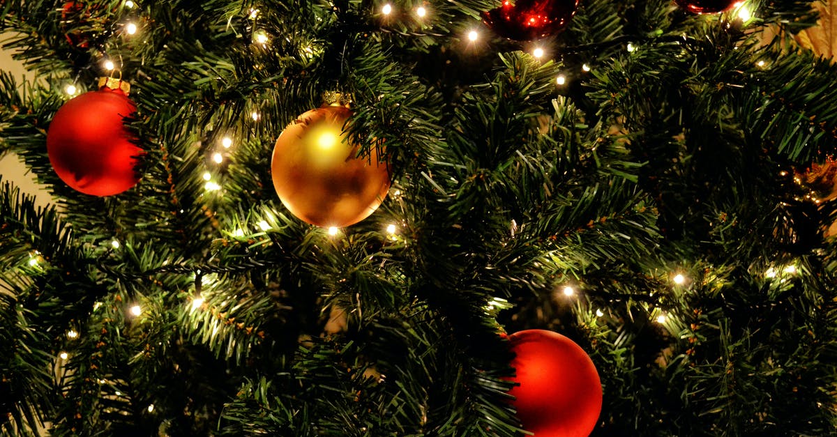 Why is that gold coin glowing green? - Green Christmas Tree With Red Baubles Why is that gold coin glowing green? - Green Christmas Tree With Red Baubles