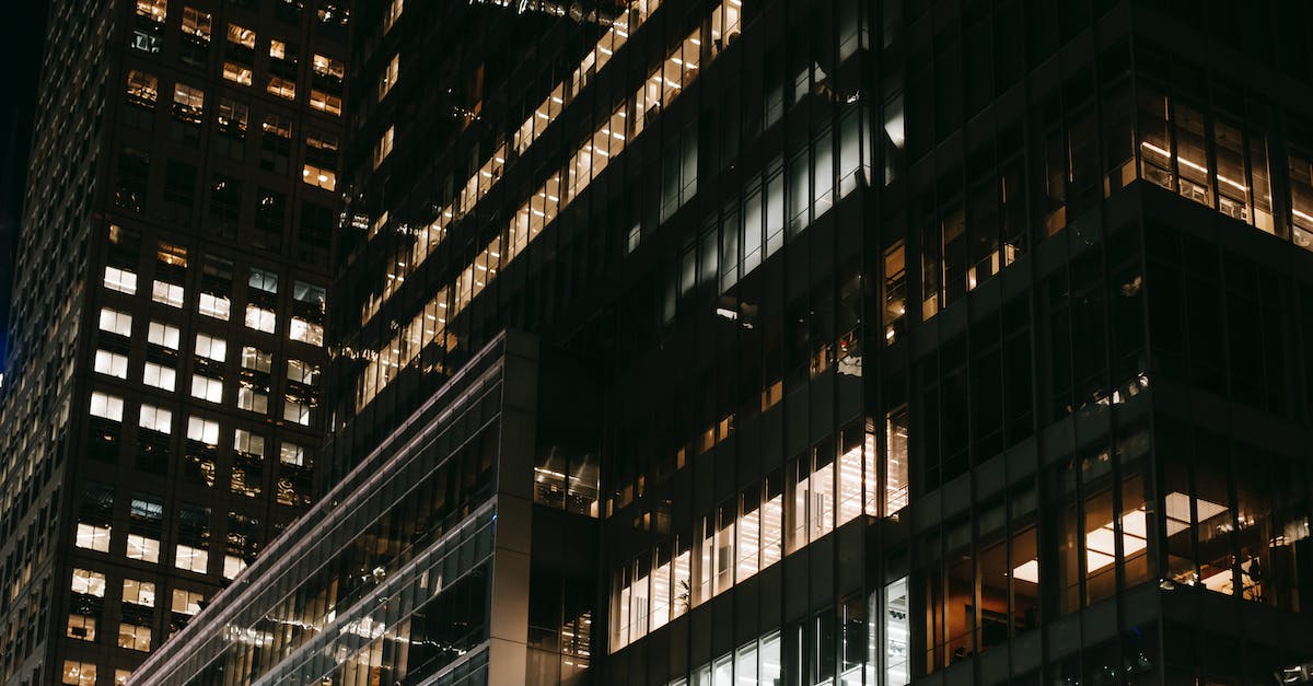 Why is the Dark Aurora full of railways and electric towers? - Contemporary skyscrapers with bright electric lights at night