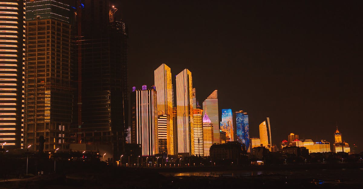 Why is the Dark Aurora full of railways and electric towers? - Modern megapolis with illuminated architecture at night