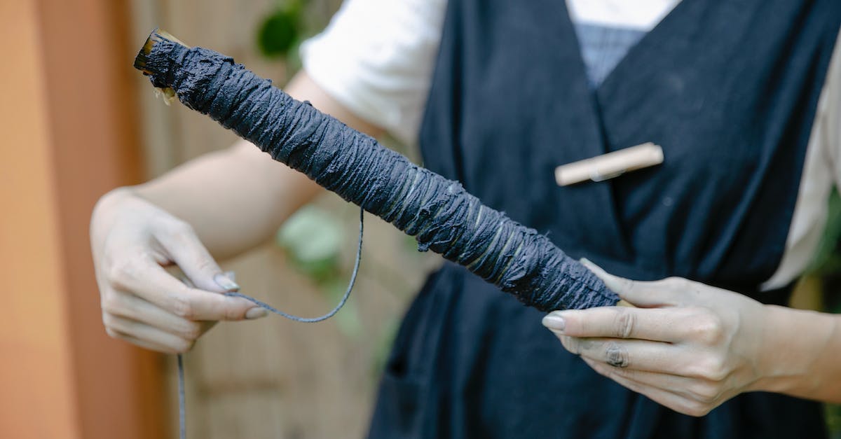 Why is the Repellant Stick exploding other creatures? - Person in Black Long Sleeve Shirt Holding Black Thread