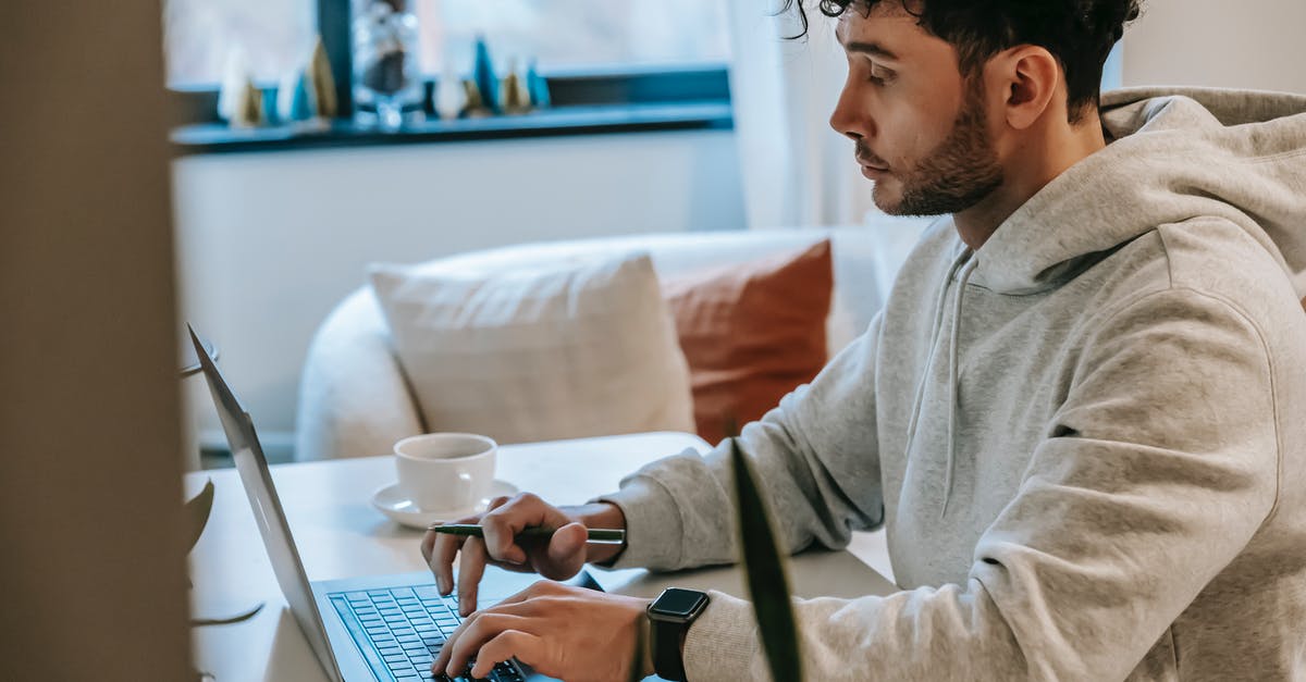 Why is the tracker in Pokémon GO not working? [duplicate] - Side view of crop focused male remote worker browsing internet on netbook at table with coffee in house