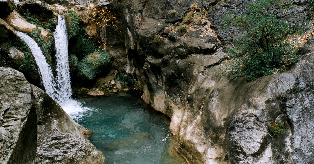 Why is there a difference between the height/weight in the Pokédex and Storage? - Picturesque scenery of high waterfall falling in water stream between  rocky mountains