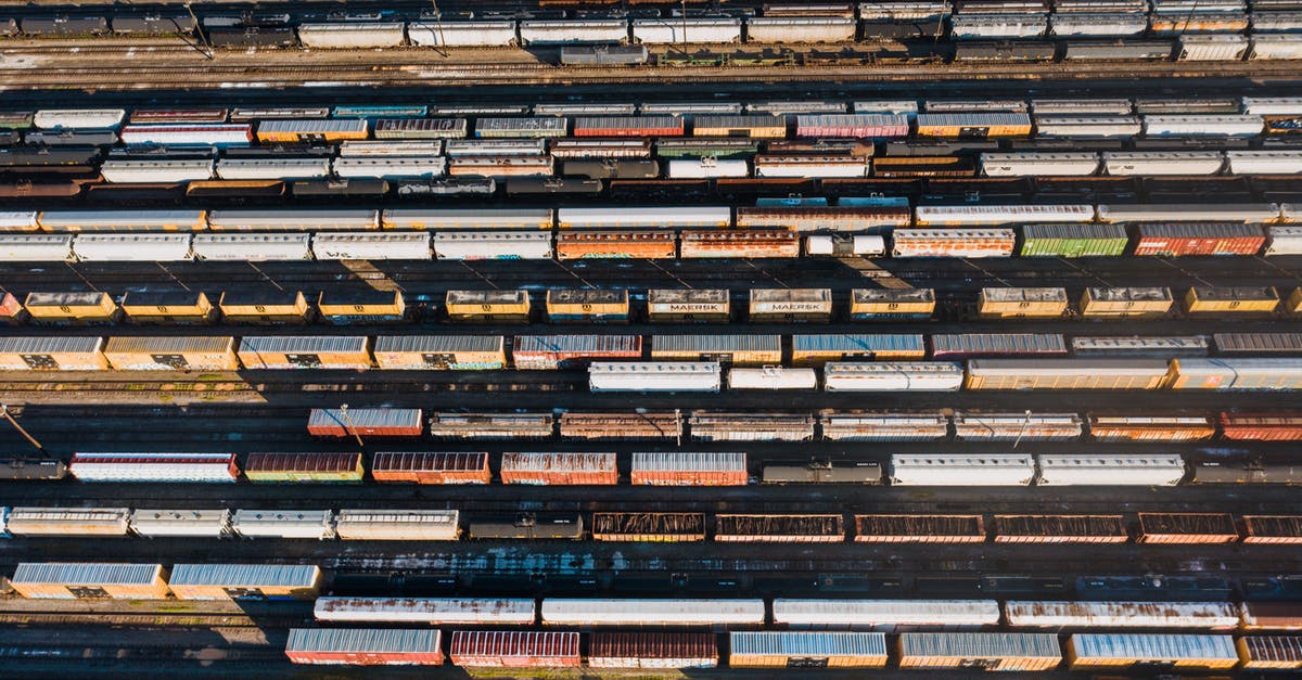 Why is there a difference between the height/weight in the Pokédex and Storage? - Top view of various transport containers in many rows in urban station in daytime Why is there a difference between the height/weight in the Pokédex and Storage? - Top view of various transport containers in many rows in urban station in daytime