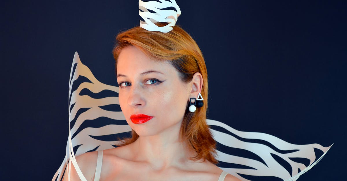 Why is there no crown symbol next to the red mickey symbols? - Alluring model with paper crown and red lips Why is there no crown symbol next to the red mickey symbols? - Alluring model with paper crown and red lips