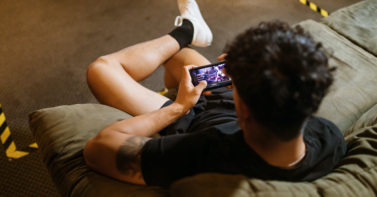 Why is Wifi seen as bad for online gaming - Man in Black Crew Neck T-shirt Playing Mobile Game Why is Wifi seen as bad for online gaming - Man in Black Crew Neck T-shirt Playing Mobile Game