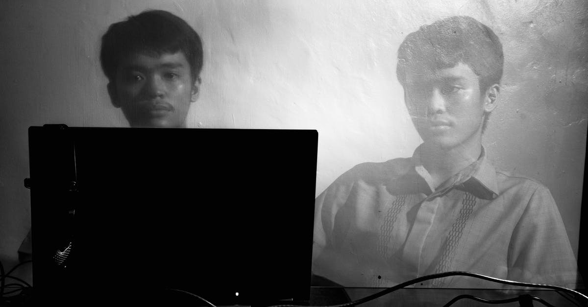 Why isn't this wiring working? - Black and white of Asian concentrated male in t shirt sitting at table with laptop against wall
