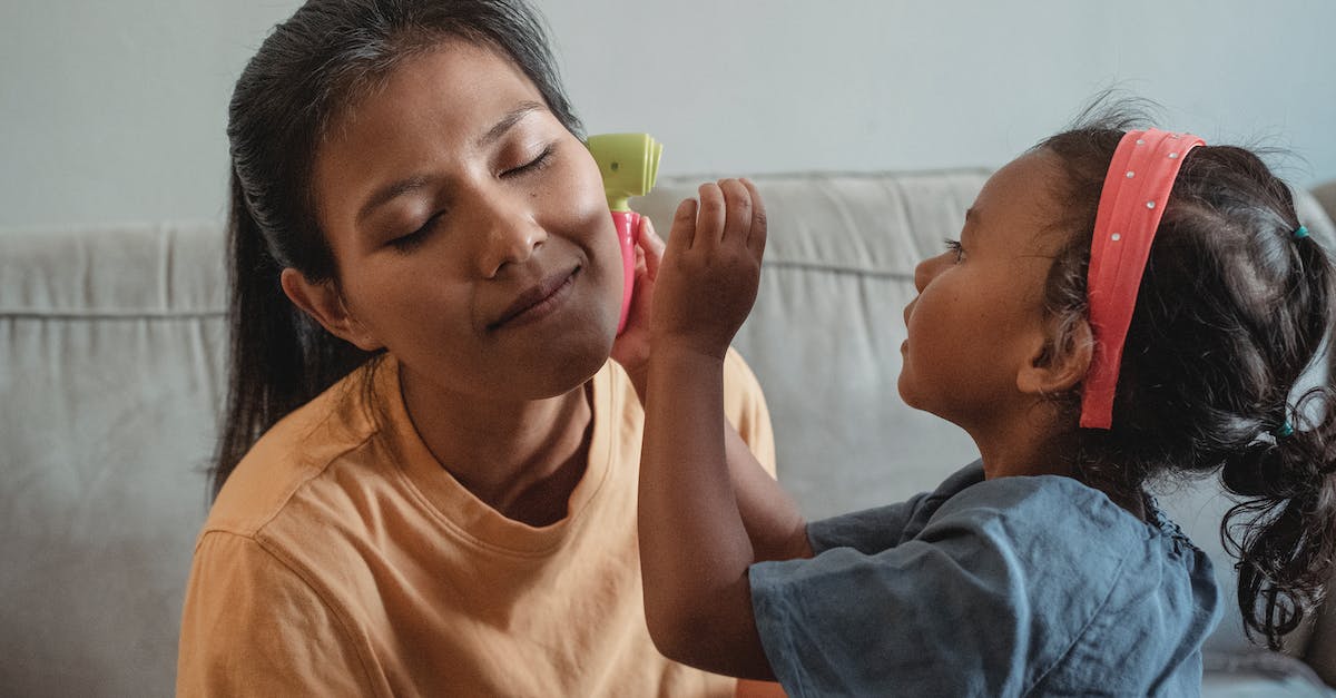 Why my mom and I can't play together, but not on a mini game server [closed] - Asian mother with closed eyes playing with daughter in apartment