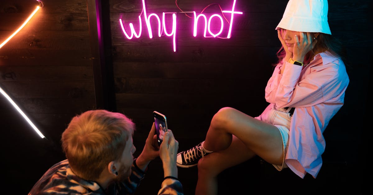 Why not ADC Nami? - Woman in Pink Button Up Shirt Holding Smartphone