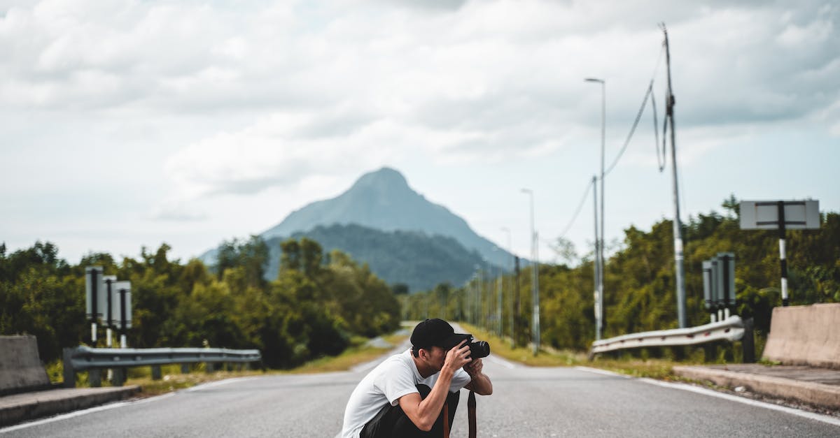 Why should I use a highway ramp? - Man Holding Dslr Camera
