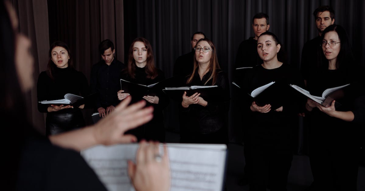 Why some members are unable to participate at war? - A Choir Singing while Holding Music Sheets Why some members are unable to participate at war? - A Choir Singing while Holding Music Sheets