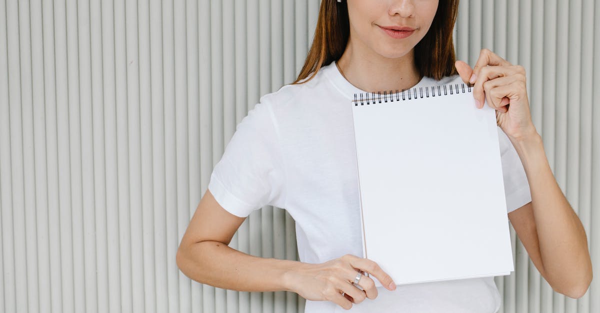 Why somethings don't show in friendly battles? - Young lady showing planner with white sheet and looking at camera