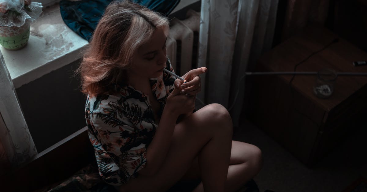 Why Tommy Vercetti killed Lance Vance and (the others) in Last mission of GTA Vice City? - Woman in White Black and Red Floral Shirt Sitting on Black Couch