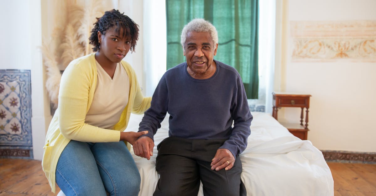 Why was Father that old, compared to Kellogg? - Woman and Elderly Man Sitting on Bed Why was Father that old, compared to Kellogg? - Woman and Elderly Man Sitting on Bed