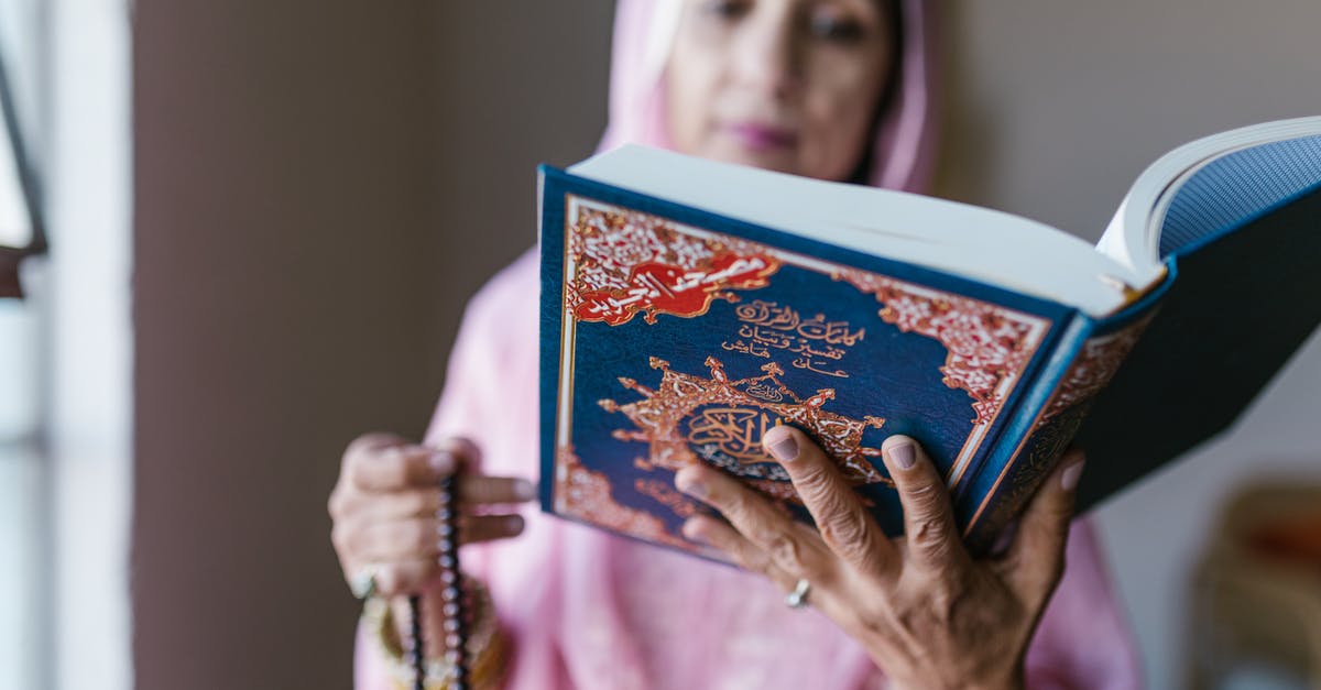 Why was Naxxramas so hard? [closed] - A Woman in Pink Hijab Praying with a Koran 