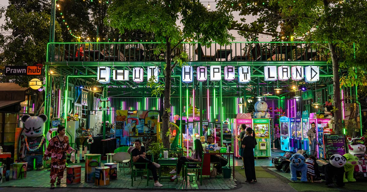 Why were arcade machines so big? - People in an Arcade Beside Trees Why were arcade machines so big? - People in an Arcade Beside Trees